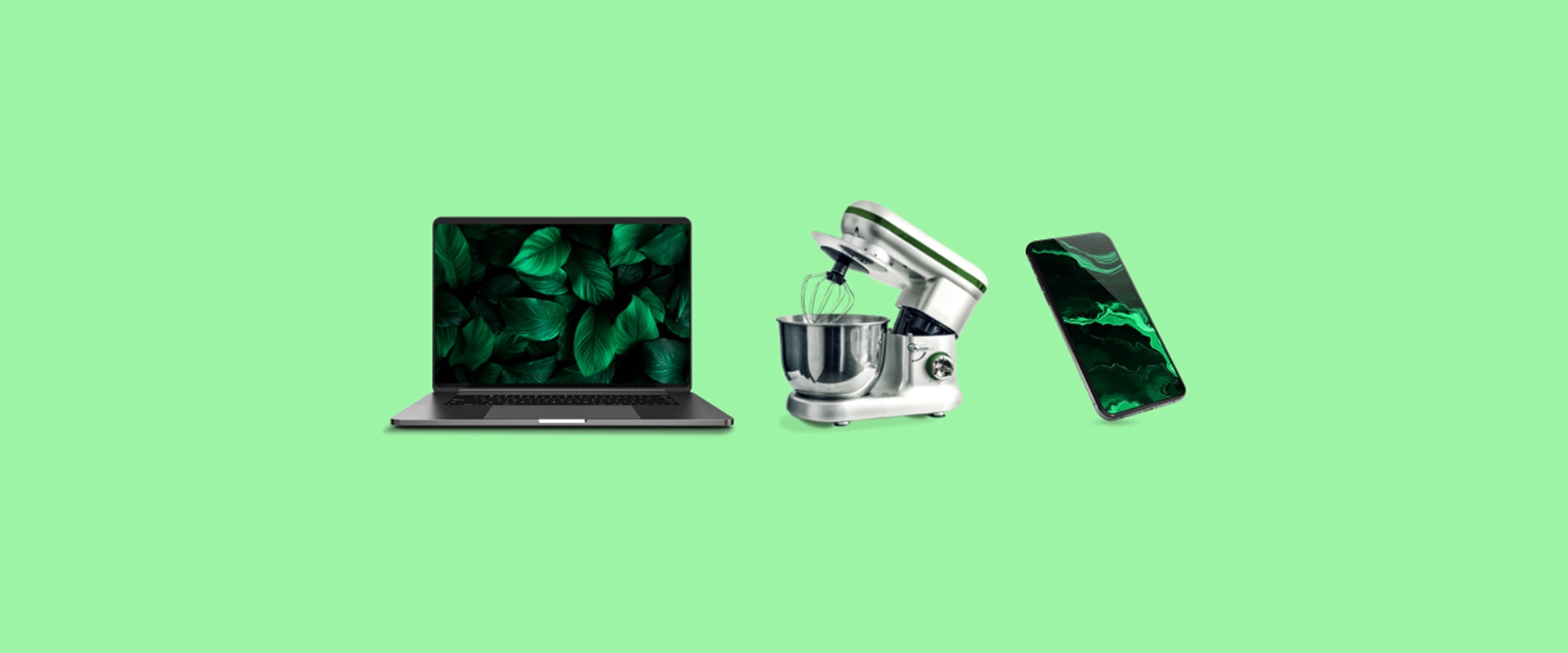 Ein Laptop, eine Küchenmaschine und ein Smartphone auf grünem Hintergrund